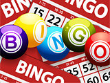 Bingo balls over red bingo cards