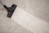 Head of vacuum cleaner in dusty carpet and clean strip