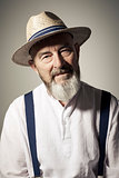 senior male portrait with a hat