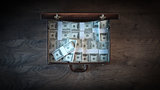 Briefcase filled with dollar packs