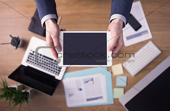 Businessman at office using a digital tablet
