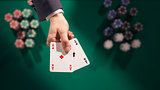 Poker player holding two aces