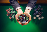 Casino playes holding a handful of chips