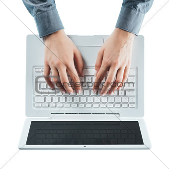 Blogger typing on a laptop