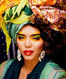 beauty bright woman with creative make up, many shawls on head l