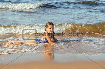 Girl playing on the beach