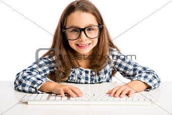 Little girl working with a computer
