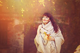 Beautiful girl outdoors with autumn leaves