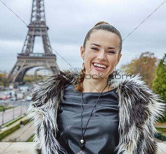 fashion-monger standing against Eiffel tower in Paris, France