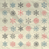 Vector Winter Snow Flakes Doodles on Crumpled Paper