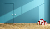 Blue room with gift on wooden floor