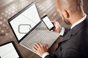 Busy businessman works with technology