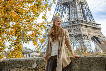 tourist woman looking into distance on embankment in Paris