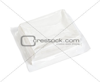Block of vacuum soft wrap box package isolated on white background