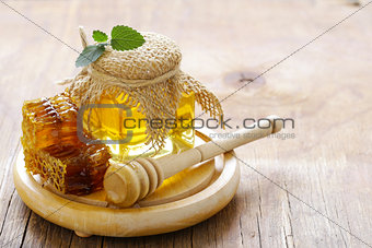 natural organic honey, honeycombs on a wooden table