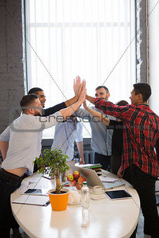 Business people showing teamwork in office