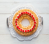 Frankfurt crown cake with cherries on white wooden