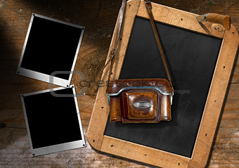 Old Camera with Blackboard and Empty Photos