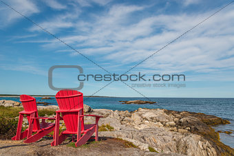 Red chairs facing Keji Seaside beach (South Shore, Nova Scotia, 