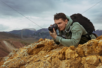 Man photographer camera mountains concept