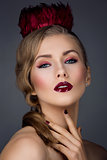 Beautiful girl with red makeup