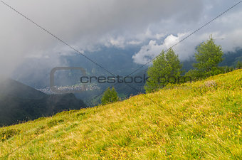 Clouds on the mountain slopes. Alps, Italy.