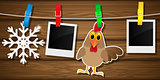 Blank photo frames, rooster and snowflake on a clothesline. Vector illustration.