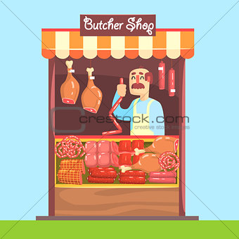 Butcher Behind Market Counter With Assortment Of Meat