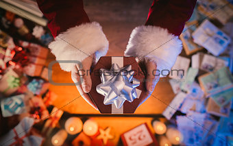Santa Claus giving a Christmas present
