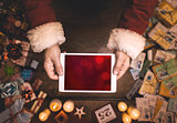 Santa Claus using a tablet