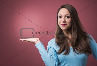 Woman presenting something at her side