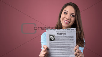 Young woman holding her resume