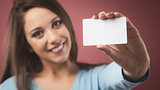 Smiling girl with business card