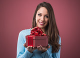 Joyful woman with gift box