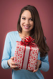 Joyful woman with gift box