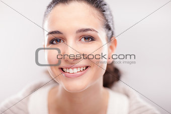 Smiling woman posing on white background