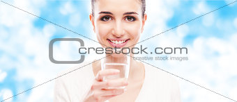 Smiling woman drinking water
