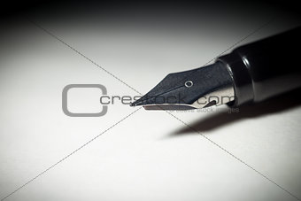 Close op of fountain pen isolated light circle