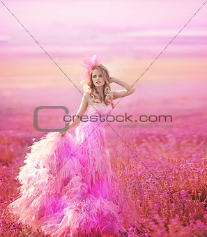 Beautiful young woman in the lavender fields.