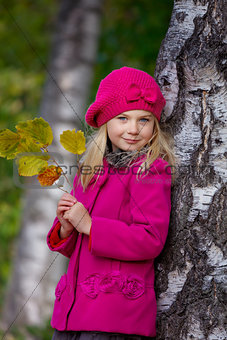 Girl having fun in autumn park