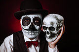 man with mexican calaveras makeup and skull