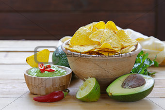 dip of avocado guacamole and corn chips, Mexican food