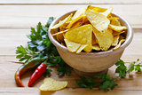 corn chips, nachos in a bowl on the table
