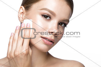 Beautiful young girl with wipes for removing makeup and French manicure. Beauty face.