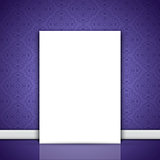Blank canvas leaning on purple wallpaper 