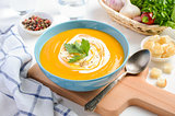 Pumpkin soup with cream and parsley