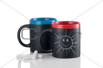 Cups with smiling sunshine