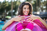 Girl in swimsuit with rubber ring