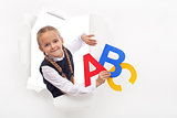 Little girl with alphabet letters and copy space