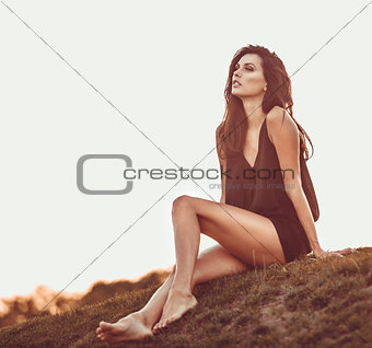 young girl sitting on grass